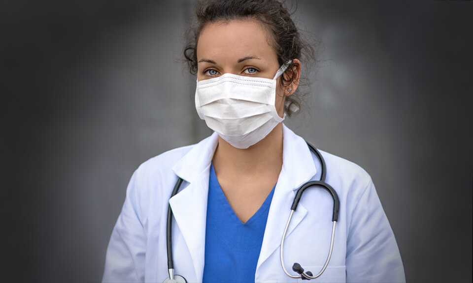 Female doctor wearing a white mask