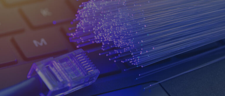 close up view of fibers alongside a cable connector on a keyboard