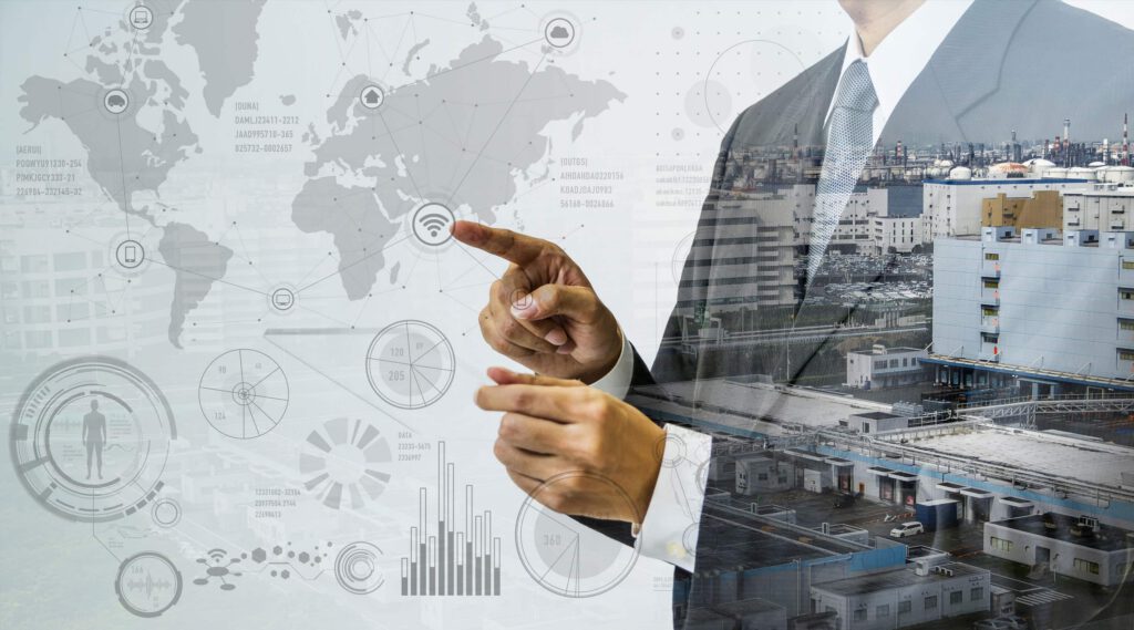 City landscape showing through a man in a suit standing and pointing at an icon on a clear screen