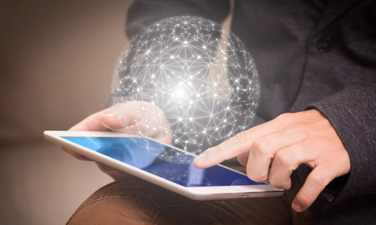 Man holding a tablet with a sphere made up of white connected links hovering above it