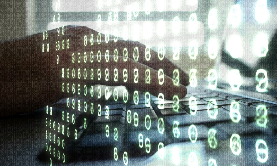 Hands typing on a laptop and random numbers superimposed at an angle