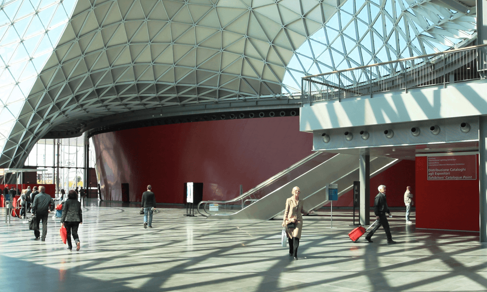 People walking in conference center foyer