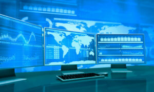 computer screens with world map data
