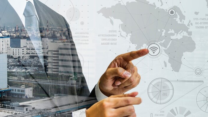 Businessman pointing to map graphics