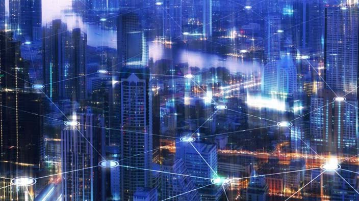 Night view of city buildings and network graphics