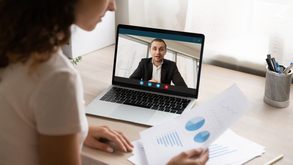 Woman working from home having a meeting via her laptop