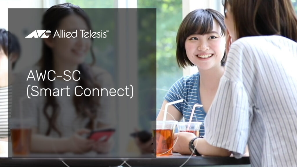 3 young women sitting in a cafe using wireless devices