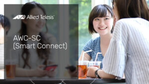 3 young women sitting in a cafe using wireless devices