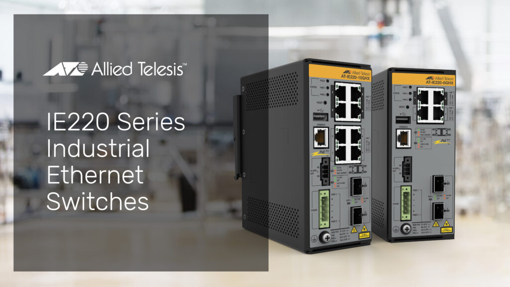 IE220 Series industrial switches on a manufacturing background