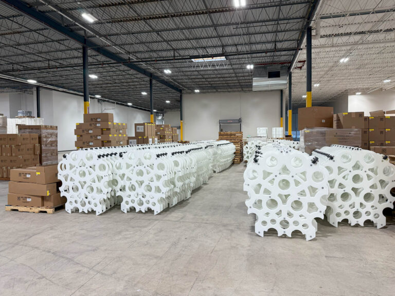 UDI factory floor showing long tubes stacked